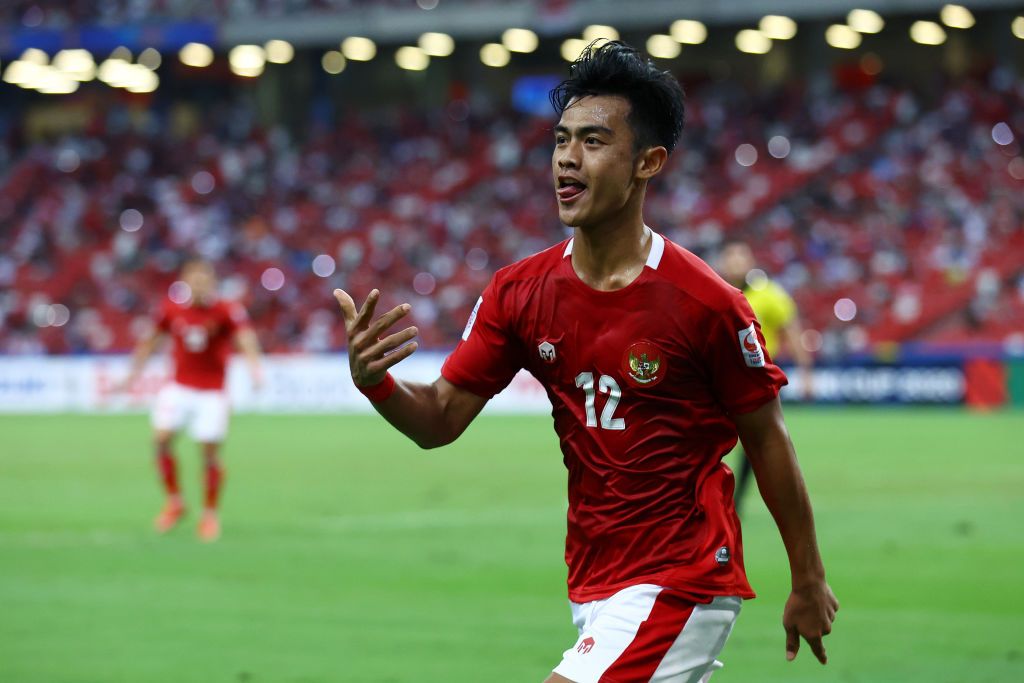 SINGAPORE, SINGAPORE - DECEMBER 25: Pratama Arhan Alif Rifai #12 of Indonesia celebrates after scoring his team's second goal against Singapore during the second half of the second leg of their AFF Suzuki Cup semifinal at the National Stadium on December 25, 2021 in Singapore. (Photo by Yong Teck Lim/Getty Images)
