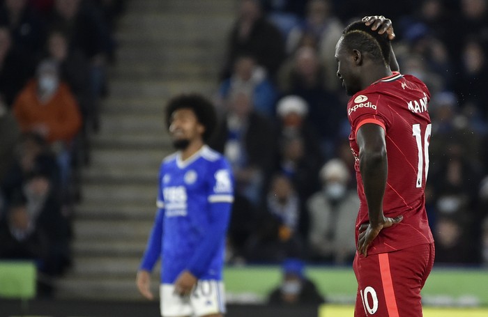 Liverpool's Sadio Mane reacts after missing a chance to score during the English Premier League soccer match between Leicester City and Liverpool at the King Power Stadium in Leicester, England, Tuesday, Dec. 28, 2021. (AP Photo/Rui Vieira)