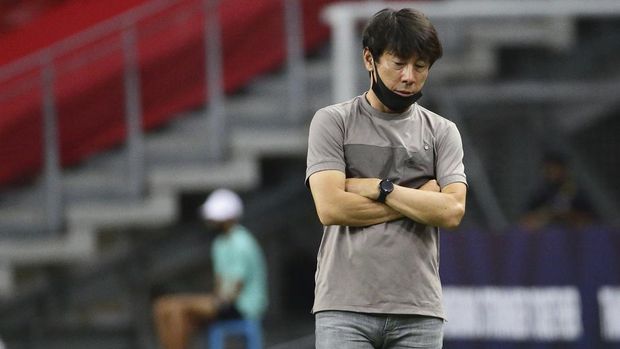 Indonesia head coach, Shin Tae Yong reacts at the touchline during the AFF Suzuki Cup 2020 final first leg soccer match between Indonesia and Thailand in Singapore, Wednesday, Dec. 29, 2021. (AP Photo/Suhaimi Abdullah)