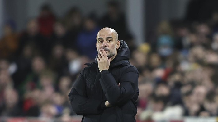 Manchester Citys head coach Pep Guardiola watches during the English Premier League soccer match between Brentford and Manchester City at the Brentford Community Stadium in London, Wednesday, Dec. 29, 2021. (AP Photo/Ian Walton)