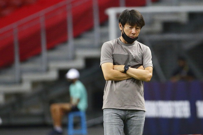 Indonesia head coach, Shin Tae Yong reacts at the touchline during the AFF Suzuki Cup 2020 final first leg soccer match between Indonesia and Thailand in Singapore, Wednesday, Dec. 29, 2021. (AP Photo/Suhaimi Abdullah)
