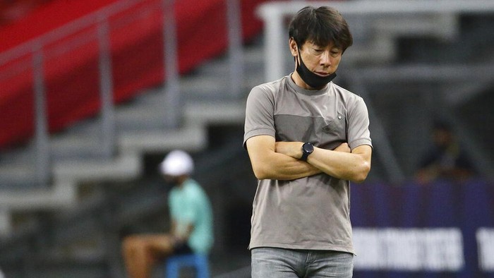 Indonesia head coach, Shin Tae Yong reacts at the touchline during the AFF Suzuki Cup 2020 final first leg soccer match between Indonesia and Thailand in Singapore, Wednesday, Dec. 29, 2021. (AP Photo/Suhaimi Abdullah)