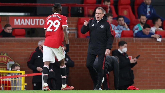 MANCHESTER, ENGLAND - DECEMBER 30: Ralf Rangnick, Manager of Manchester United interacts with Aaron Wan-Bissaka of Manchester United during the Premier League match between Manchester United and Burnley at Old Trafford on December 30, 2021 in Manchester, England. (Photo by Clive Brunskill/Getty Images)