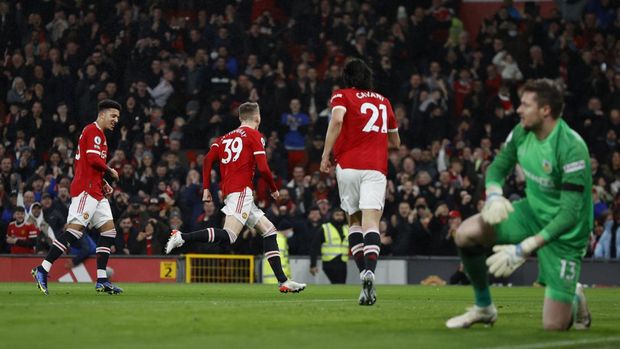 Soccer Football - Premier League - Manchester United v Burnley - Old Trafford, Manchester, Britain - December 30, 2021 Manchester United's Scott McTominay celebrates scoring their first goal with Jadon Sancho REUTERS/Phil Noble EDITORIAL USE ONLY. No use with unauthorized audio, video, data, fixture lists, club/league logos or 'live' services. Online in-match use limited to 75 images, no video emulation. No use in betting, games or single club /league/player publications.  Please contact your account representative for further details.