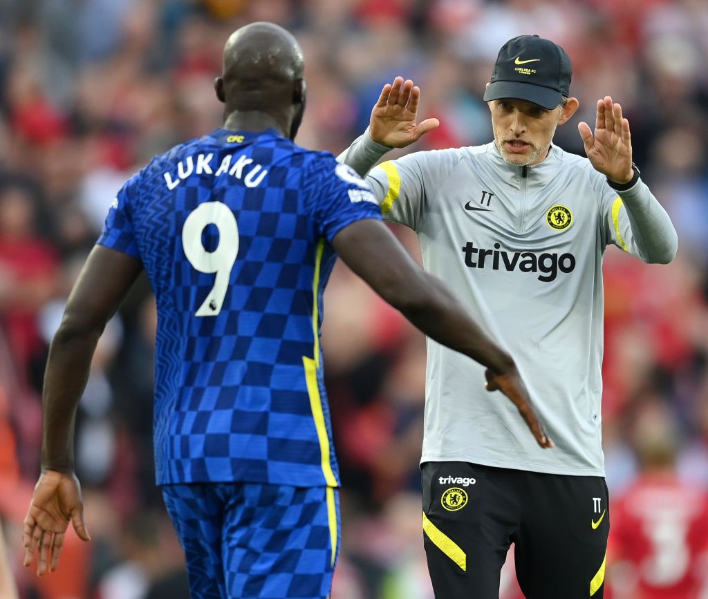 LIVERPOOL, ENGLAND - AUGUST 28: Thomas Tuchel, Manager of Chelsea and Romelu Lukaku of Chelsea interact during the Premier League match between Liverpool  and  Chelsea at Anfield on August 28, 2021 in Liverpool, England. (Photo by Michael Regan/Getty Images)