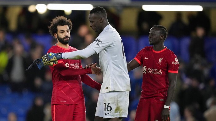 Chelseas goalkeeper Edouard Mendy and Liverpools Mohamed Salah embrace after the English Premier League soccer match between Chelsea and Liverpool at Stamford Bridge in London, Sunday, Jan. 2, 2022. The match ended in a 2-2 draw. (AP Photo/Matt Dunham)