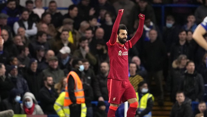 Liverpools Mohamed Salah celebrates after scoring his sides second goal during the English Premier League soccer match between Chelsea and Liverpool at Stamford Bridge in London, Sunday, Jan. 2, 2022. (AP Photo/Matt Dunham)