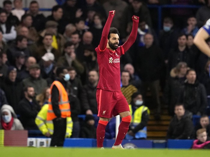 Liverpool's Mohamed Salah celebrates after scoring his side's second goal during the English Premier League soccer match between Chelsea and Liverpool at Stamford Bridge in London, Sunday, Jan. 2, 2022. (AP Photo/Matt Dunham)