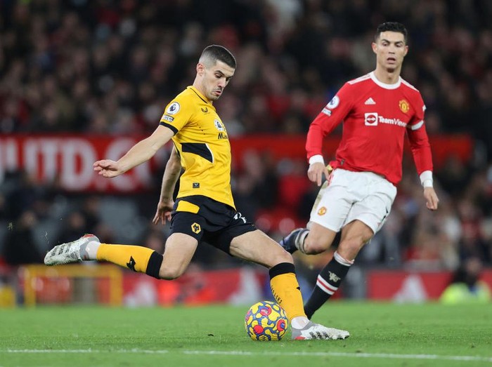 MANCHESTER, ENGLAND - JANUARY 03: Conor Coady of Wolverhampton Wanderers clears the ball during the Premier League match between Manchester United and Wolverhampton Wanderers at Old Trafford on January 03, 2022 in Manchester, England. (Photo by Clive Brunskill/Getty Images)