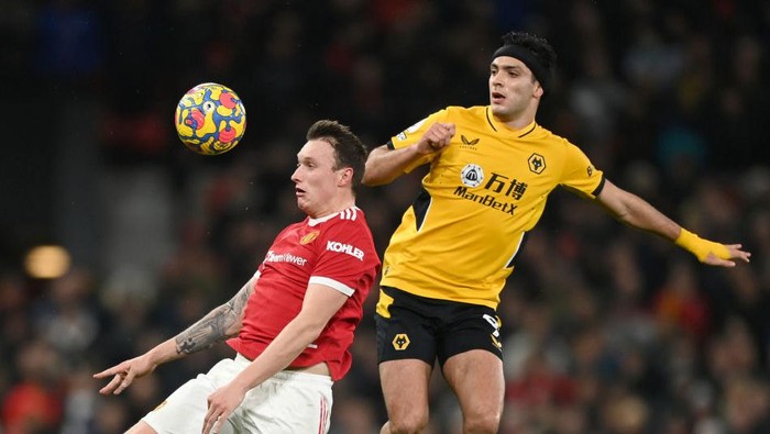 MANCHESTER, ENGLAND - JANUARY 03: Phil Jones of Manchester United and Raul Jimenez of Wolverhampton Wanderers battle for possession during the Premier League match between Manchester United and Wolverhampton Wanderers at Old Trafford on January 03, 2022 in Manchester, England. (Photo by Gareth Copley/Getty Images)