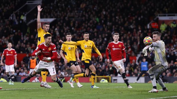 Soccer Football - Premier League - Manchester United v Wolverhampton Wanderers - Old Trafford, Manchester, Britain - January 3, 2022 Manchester United's Cristiano Ronaldo scores their first goal in an offside position so the goal is disallowed REUTERS/Phil Noble EDITORIAL USE ONLY. No use with unauthorized audio, video, data, fixture lists, club/league logos or 'live' services. Online in-match use limited to 75 images, no video emulation. No use in betting, games or single club /league/player publications.  Please contact your account representative for further details.