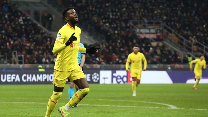 MILAN, ITALY - DECEMBER 07: Divock Origi of Liverpool celebrates after scoring their sides second goal during the UEFA Champions League group B match between AC Milan and Liverpool FC at Giuseppe Meazza Stadium on December 07, 2021 in Milan, Italy. (Photo by Marco Luzzani/Getty Images)