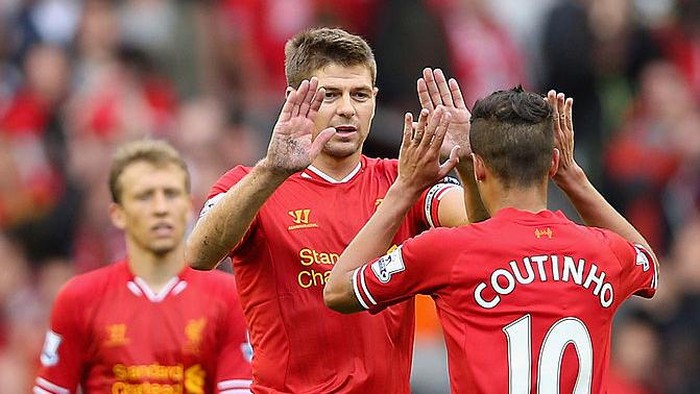 LIVERPOOL, ENGLAND - AUGUST 17:  Steven Gerrard of Liverpool celebrates victory with team mate Philippe Coutinho after the final whistle during the Barclays Premier League match between Liverpool and Stoke City at Anfield on August 17, 2013 in Liverpool, England.  (Photo by Clive Brunskill/Getty Images)