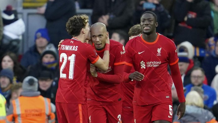 Liverpools Fabinho, center, celebrates with teammates after scoring his sides fourth goal during the English FA Cup third round soccer match between Liverpool and Shrewsbury Town at Anfield stadium in Liverpool, Sunday, Jan. 9, 2022. (AP Photo/Jon Super)