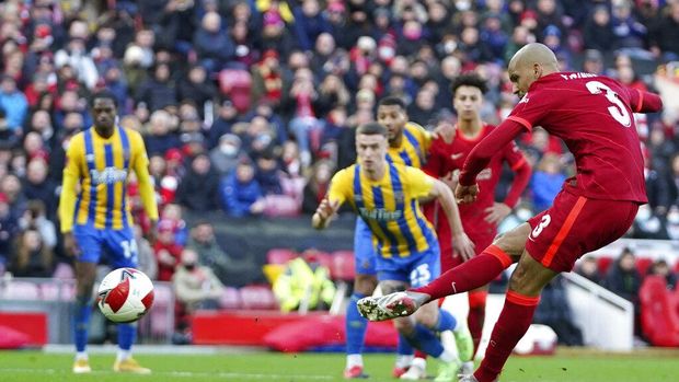 Liverpool's Fabinho scores his side's second goal from penalty spot during the English FA Cup third round soccer match between Liverpool and Shrewsbury Town at Anfield stadium in Liverpool, Sunday, Jan. 9, 2022. (AP Photo/Jon Super)