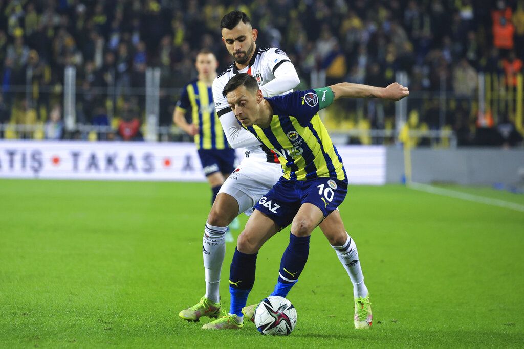 Fenerbahce's Mesut Ozil celebrates after scoring his side's first goal during the Turkish Super League soccer match between Galatasaray and Fenerbahce, in Istanbul, Turkey, Sunday, Nov. 21, 2021. (AP Photo)