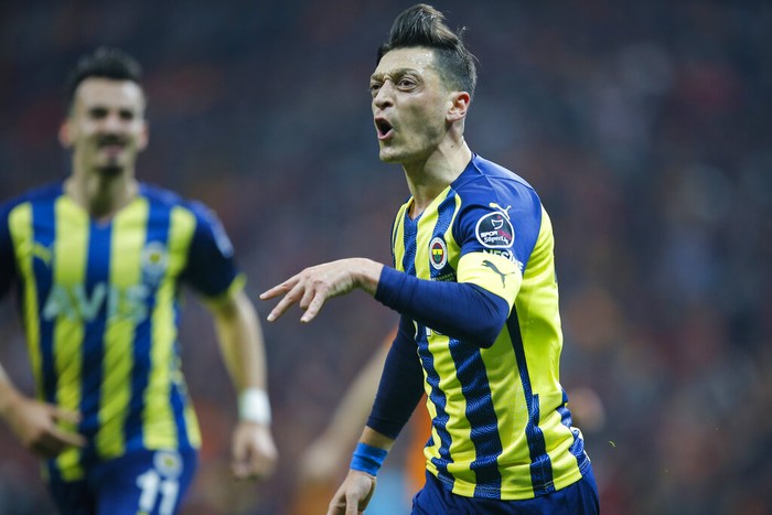 Fenerbahces Mesut Ozil celebrates after scoring his sides first goal during the Turkish Super League soccer match between Galatasaray and Fenerbahce, in Istanbul, Turkey, Sunday, Nov. 21, 2021. (AP Photo)
