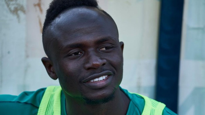 DAKAR, SENEGAL - MARCH 26: Sadio Mane looks on as he sits in the bench ahead of a friendly match between Senegal and Mali after both teams qualified for the 2019 CAN held in Egypt, on March 26, 2019 in Dakar, Senegal. (Photo by Xaume Olleros/Getty Images)