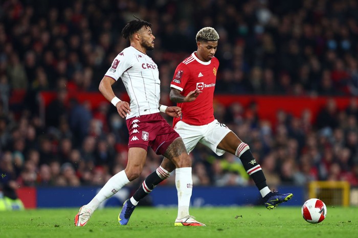 MANCHESTER, ENGLAND - JANUARY 10: Tyrone Mings of Aston Villa tackles Marcus Rashford of Manchester United during the Emirates FA Cup Third Round match between Manchester United and Aston Villa at Old Trafford on January 10, 2022 in Manchester, England. (Photo by Clive Brunskill/Getty Images)