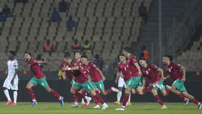Moroccos Sofiane Boufal, second left, celebrates with teammates after scoring during the African Cup of Nations 2022 group B soccer match between Morocco and Ghana at the Ahmadou Ahidjo stadium in Yaounde, Cameroon, Monday Jan. 10, 2021. (AP Photo/Themba Hadebe)