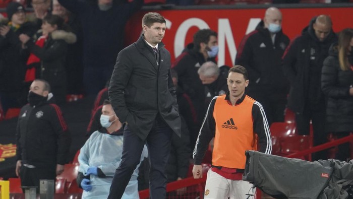Aston Villa head coach Steven Gerrard leaves the pitch at the end of the English FA Cup third round soccer match between Manchester United and Aston Villa outside Old Trafford stadium in Manchester, England, Monday, Jan. 10, 2022. Manchester United won 1-0. (AP Photo/Jon Super)