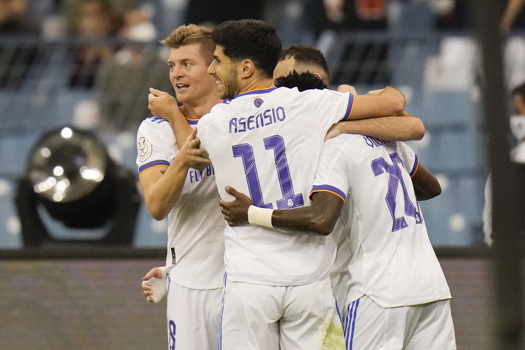 Real Madrid's players celebrate after a goal during the Spanish Super Cup semi final soccer match between Barcelona and Real Madrid at King Fahd stadium in Riyadh, Saudi Arabia, Wednesday, Jan. 12, 2022. (AP Photo/Hassan Ammar)