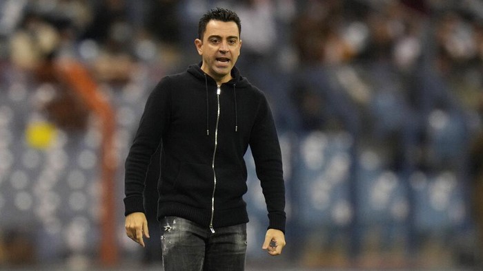 Barcelonas head coach Xavi Hernandez reacts during the Spanish Super Cup semi final soccer match between Barcelona and Real Madrid at King Fahd stadium in Riyadh, Saudi Arabia, Wednesday, Jan. 12, 2022. (AP Photo/Hassan Ammar)