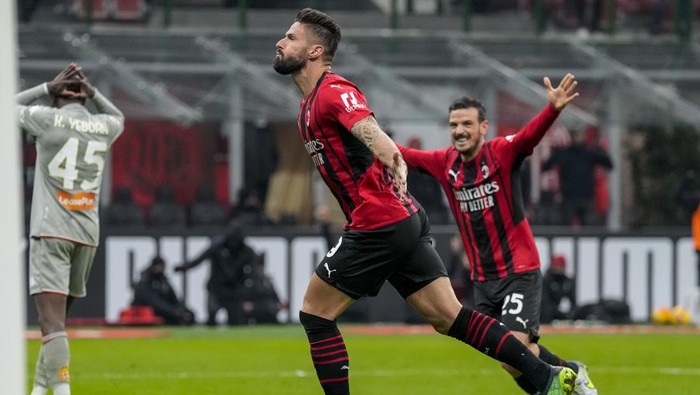 AC Milans Olivier Giroud reacts after scoring his sides first goal during an Italian Cup soccer match between AC Milan and Genoa at the San Siro stadium in Milan, Italy, Thursday, Jan. 13, 2022. (AP Photo/Antonio Calanni)