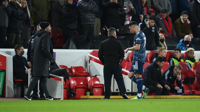 LIVERPOOL, ENGLAND - JANUARY 13: Granit Xhaka of Arsenal leaves the field of play after being sent off during the Carabao Cup Semi Final First Leg match between Liverpool and Arsenal at Anfield on January 13, 2022 in Liverpool, England. (Photo by Michael Regan/Getty Images)