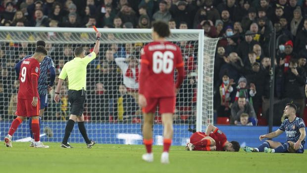 Arsenal's Granit Xhaka sees the red card after a foul during the EFL Cup semifinal, first leg soccer match between Liverpool and Arsenal at the Anfield Stadium in Liverpool, Thursday, Jan.13, 2022.(AP Photo/Jon Super)