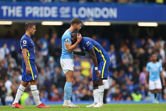LONDON, ENGLAND - SEPTEMBER 25: Ruben Dias of Manchester City interacts with Antonio Ruediger of Chelsea after the Premier League match between Chelsea and Manchester City at Stamford Bridge on September 25, 2021 in London, England. (Photo by Catherine Ivill/Getty Images)