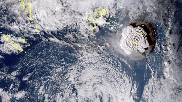 In this satellite image taken by Himawari-8, a Japanese weather satellite, and released by the agency, shows an undersea volcano eruption at the Pacific nation of Tonga Saturday, Jan. 15, 2022. An undersea volcano erupted in spectacular fashion near the Pacific nation of Tonga on Saturday, sending large waves crashing across the shore and people rushing to higher ground. (Japan Meteorology Agency via AP)