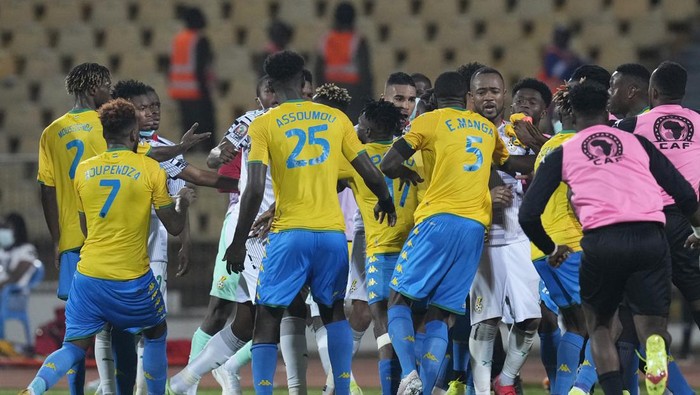 A scuffle breaks out after the final whistle between Gabon and Ghana players at the end of the during the African Cup of Nations 2022 group C soccer match between Gabon and Ghana at the Ahmadou Ahidjo stadium in Yaounde, Cameroon, Friday, Jan. 14, 2022. (AP Photo/Themba Hadebe)
