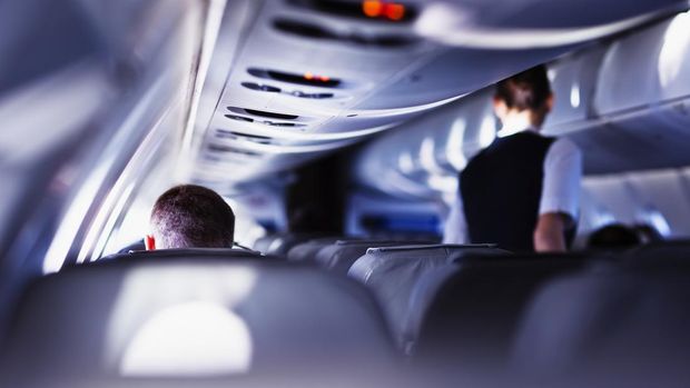 Airplane cabin during flight. Shallow DOF, selective focus.