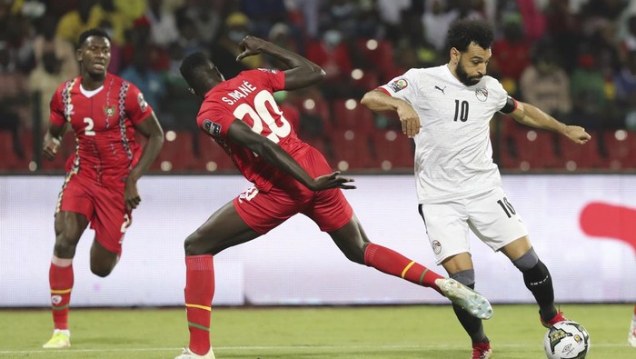 Egypts Mohamed Salah in action by Soriano Mane of Guinea-Bissau during the African Cup of Nations Group D soccer match between Egypt and Guinea-Bissau in Garoua, Cameroon, Saturday, Jan. 15, 2022. (AP Photo/Footografiia)