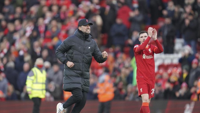 Liverpools manager Jurgen Klopp runs onto the pitch to celebrate at the end of an English Premier League soccer match between Liverpool and Brentford at Anfield in Liverpool, England, Sunday, Jan. 16, 2022. (AP Photo/Jon Super)
