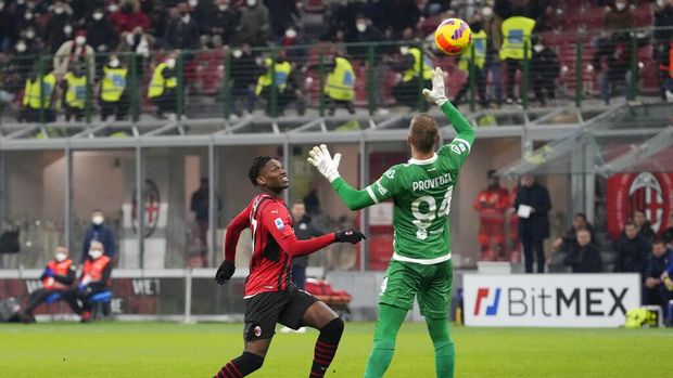 AC Milan's Rafael Leao, left, scores against Spezia during a Serie A soccer match between AC Milan and Spezia, at the San Siro stadium in Milan, Italy, Monday, Jan.17, 2022. (AP Photo/Luca Bruno)