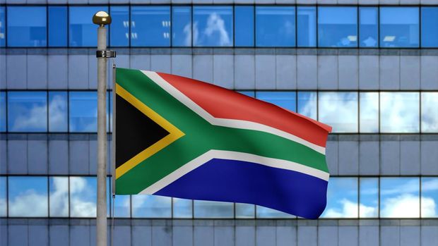 3D illustration African RSA flag waving in a modern skyscraper city. Beautiful tall tower with South Africa banner blowing soft silk. Cloth fabric texture ensign background.