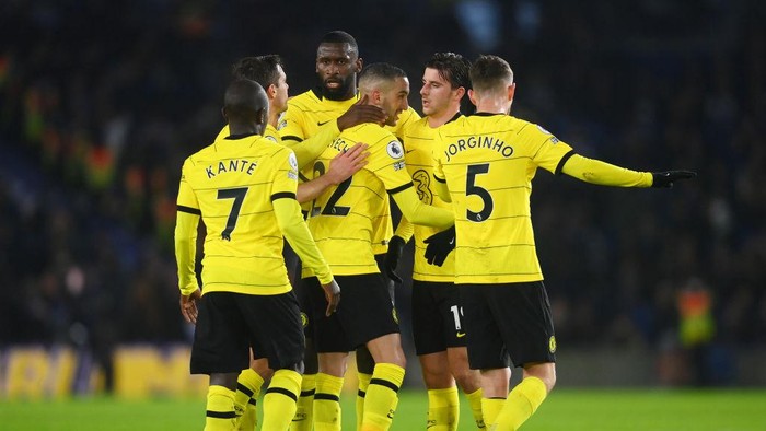Chelseas Marcos Alonso, left, Chelseas NGolo Kante, center, and Chelseas head coach Thomas Tuchel leave the field after the English Premier League soccer match between Brighton and Chelsea at the Falmer stadium in Brighton, England, Tuesday, Jan. 18, 2022. (AP Photo/Matt Dunham)