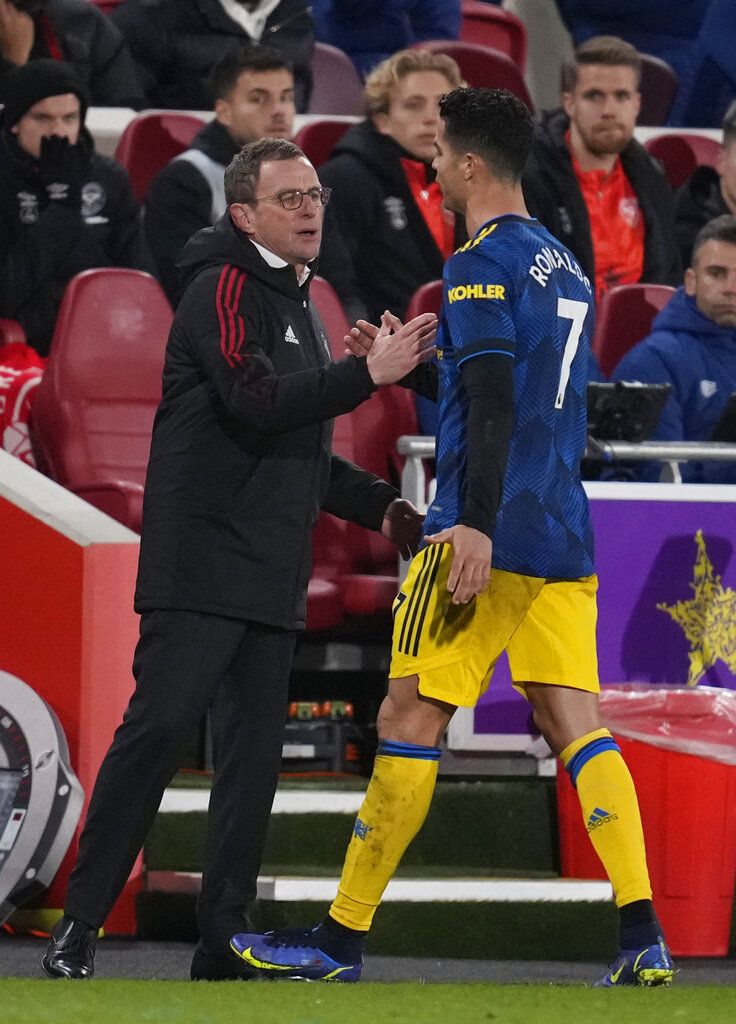 Manchester United's Cristiano Ronaldo shakes hands with Manchester United's interim manager Ralf Rangnick after being substituted during an English Premier League soccer match between Brentford and Manchester United at the Brentford Community Stadium in London, Wednesday, Jan. 19, 2022. (AP Photo/Matt Dunham)