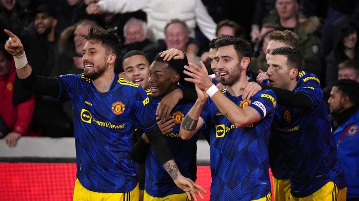 Manchester Uniteds Anthony Elanga, 3rd left, celebrates with team mates after scoring the opening goal during an English Premier League soccer match between Brentford and Manchester United at the Brentford Community Stadium in London, Wednesday, Jan. 19, 2022. (AP Photo/Matt Dunham)