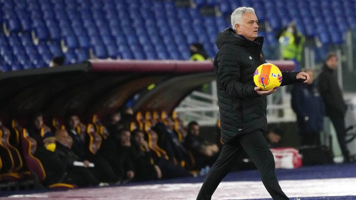 Romas head coach Jose Mourinho holds the ball during the Italian Cup soccer match between Roma and Lecce at Romes Olympic stadium, Thursday, Jan. 20, 2022. (AP Photo/Alessandra Tarantino)