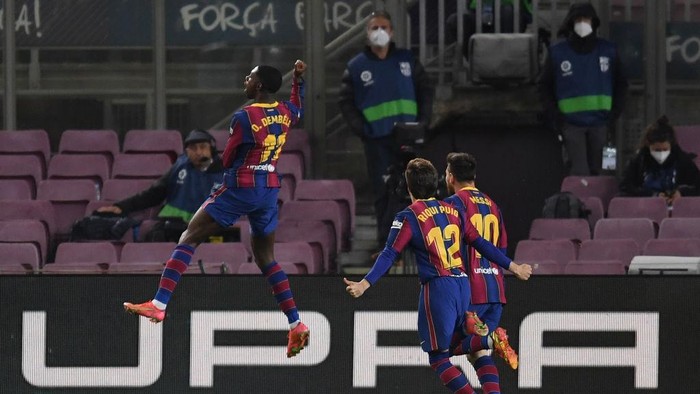 Ousmane Dembele BARCELONA, SPAIN - APRIL 05: Ousmane Dembele of FC Barcelona celebrates with teammates after scoring their team's first goal during the La Liga Santander match between FC Barcelona and Real Valladolid CF at Camp Nou on April 05, 2021 in Barcelona, Spain. Sporting stadiums around Spain remain under strict restrictions due to the Coronavirus Pandemic as Government social distancing laws prohibit fans inside venues resulting in games being played behind closed doors. (Photo by Alex Caparros/Getty Images)