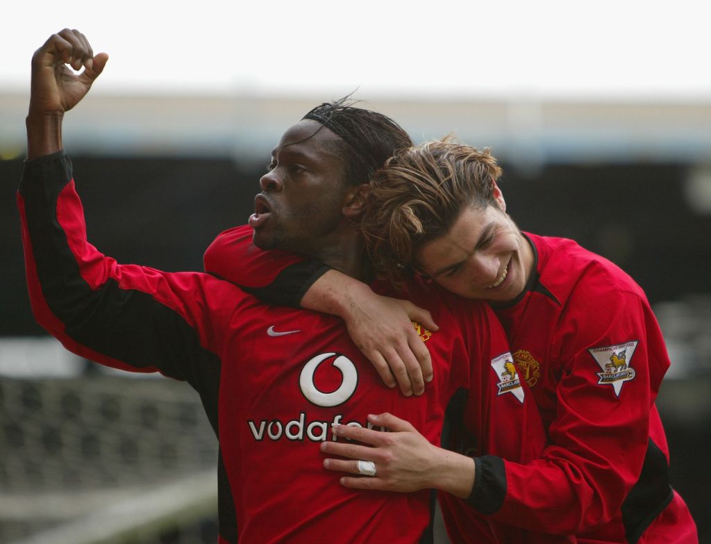 BIRMINGHAM, ENGLAND - APRIL 10: Manchester United goalscorers, Louis Saha (L) and Ronaldo celebrate after Saha had scored the secod goal for United during the FA Barclaycard Premiership match between Birmingham City and Manchester United at St Andrews on April 10, 2004 in Birmingham, England.  (Photo by Stu Forster/Getty Images)