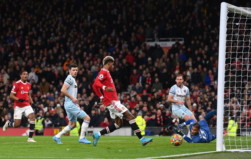 MANCHESTER, ENGLAND - JANUARY 22: Marcus Rashford of Manchester United scores their team's first goal during the Premier League match between Manchester United and West Ham United at Old Trafford on January 22, 2022 in Manchester, England. (Photo by Laurence Griffiths/Getty Images)