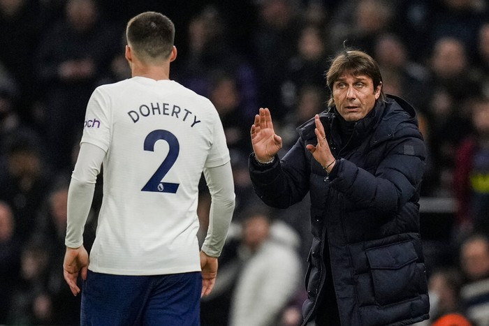 Tottenhams head coach Antonio Conte talks to Tottenhams Matt Doherty during the English League Cup semifinal second leg soccer match between Tottenham Hotspur and Chelsea at the Tottenham Hotspur Stadium in London, Wednesday, Jan. 12, 2022. (AP Photo/Alastair Grant)