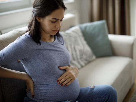 Young pregnant woman suffering from backache