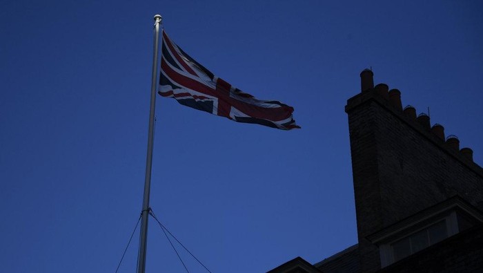 FILE - In this file photo dated Monday, Dec. 14, 2020, the Union Flag flies on the top of 10 Downing Street, the Prime Ministers official residence in London. The British government said Wednesday March 24, 2021, the national flag should be flown every day on all public buildings, the latest move in an increasing embrace of the Union flag. (AP Photo/Alberto Pezzali, FILE)