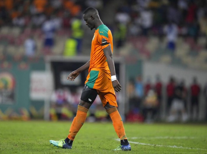 Ivory Coasts Eric Bailly walks back after his penalty kick was saved by Egypts goalkeeper Mohamed Abou Gabal, during the African Cup of Nations 2022 round of 16 soccer match between Ivory Coast and Egypt at the Japoma Stadium in Douala, Cameroon, Wednesday, Jan. 26, 2022. Egypt beat Ivory Coast 5-4 on penalties. (AP Photo/Themba Hadebe)
