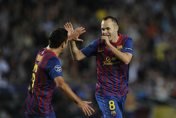 BARCELONA, SPAIN - OCTOBER 19:  Andres Iniesta of FC Barcelona (R) celebrates with his teammate Xavi Hernandez after scoring the opening goal during the UEFA Champions League Group H match between FC Barcelona and FC Viktoria Plzen at Camp Nou on October 19, 2011 in Barcelona, Spain.  (Photo by David Ramos/Getty Images)